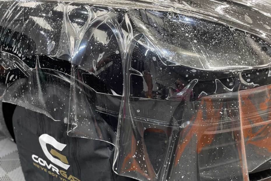 black car having PPF coating applied